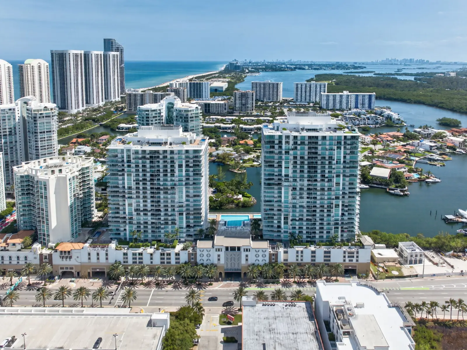 Aerial view of the towers along a waterway with the coastline beyond
